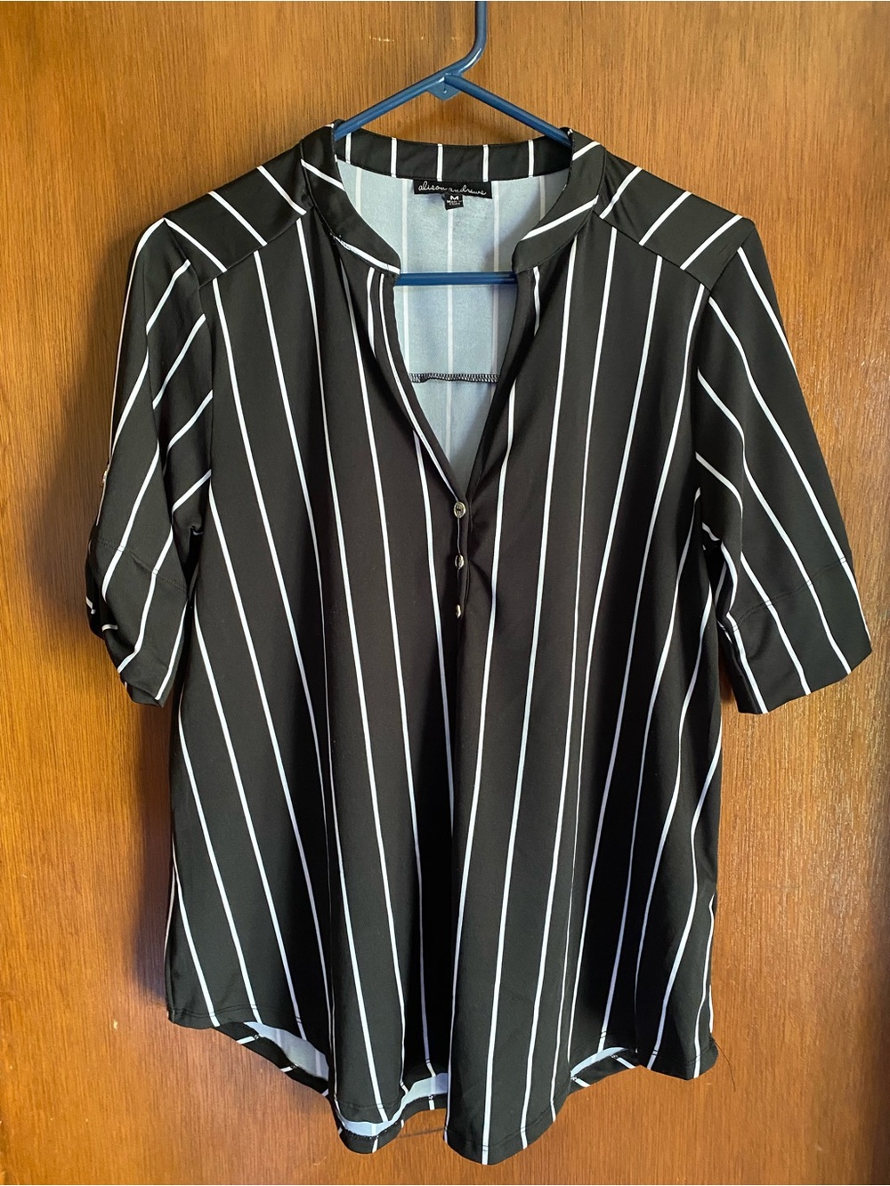 Woman’s Black & White Striped V-Neck Blouse